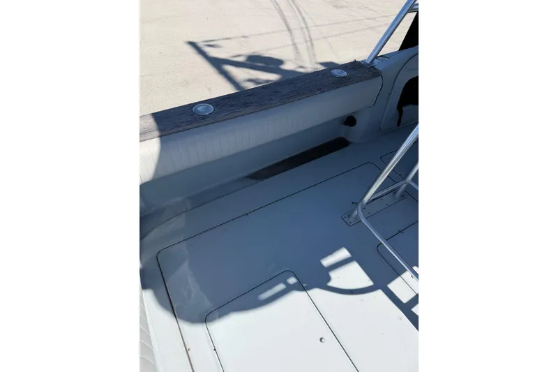 Slide: The Image of 2020 Strike 26' Center Console Cuddy boat deck with seating and railing. - 7