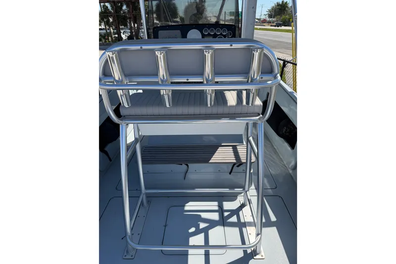 Slide: The Image of 2020 Strike 26' Center Console Cuddy boat interior with rod holders and seating. - 9