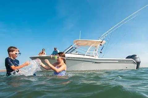 Slide: The Image of Manufacturer Provided Image: Children playing in water near 2017 Grady-White Freedom 275 boat. - 18