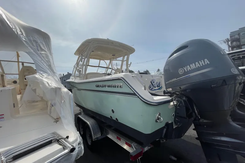 Slide: The Image of 2017 Grady-White Freedom 275 boat with Yamaha engine on trailer, outdoor display. - 2
