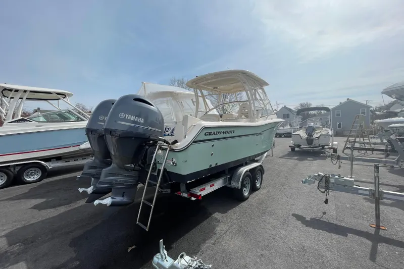Slide: The Image of 2017 Grady-White Freedom 275 boat with Yamaha engines on a trailer. - 4