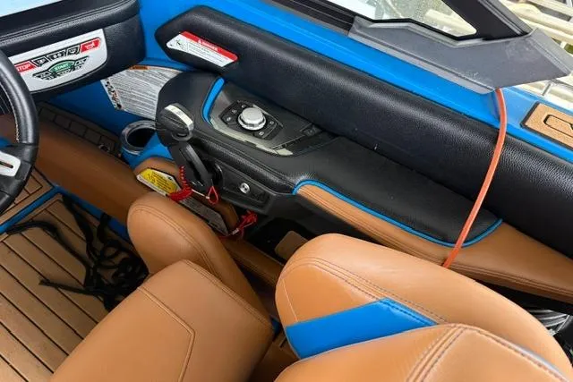 Slide: The Image of Interior of 2020 Nautique Super Air Nautique G25 boat with tan and blue seating. - 18