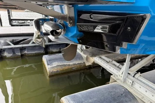 Slide: The Image of 2020 Nautique Super Air Nautique G25 boat on lift, showing propeller and NSS system. - 26