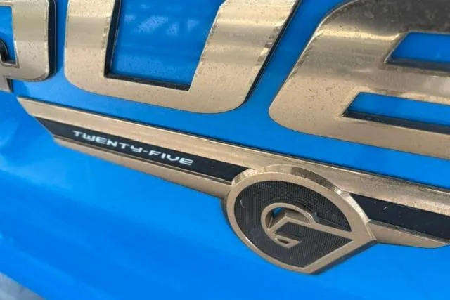 Slide: The Image of Close-up of 2020 Nautique Super Air Nautique G25 logo on blue surface. - 28