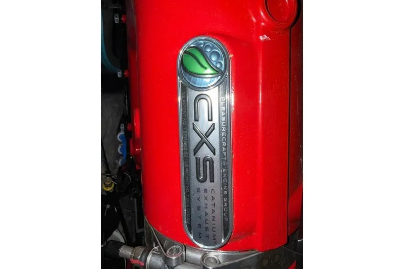 Slide: The Image of Red engine component of 2020 Nautique Super Air Nautique G25 with CXS emblem. - 31