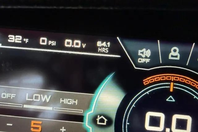Slide: The Image of Dashboard display of a 2020 Nautique Super Air Nautique G25 boat showing temperature and hours. - 7
