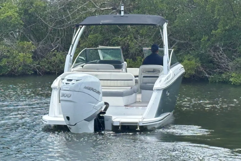 Slide: The Image of 2019 Cobalt 23SC boat with Mercury 300 engine navigating through water. - 8