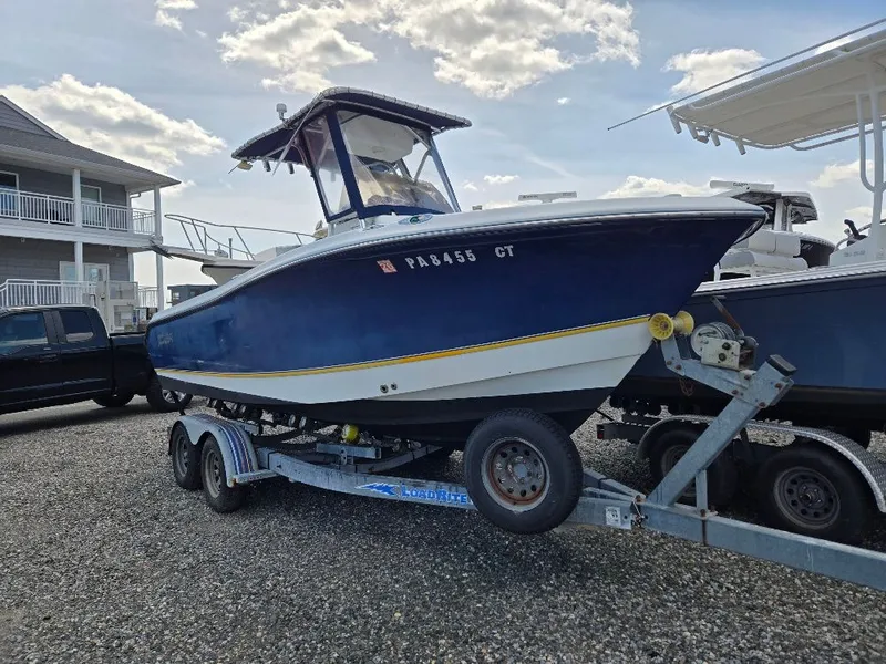 The Image of 2004 Polar 2100 CC Center Console boat on trailer. - 0