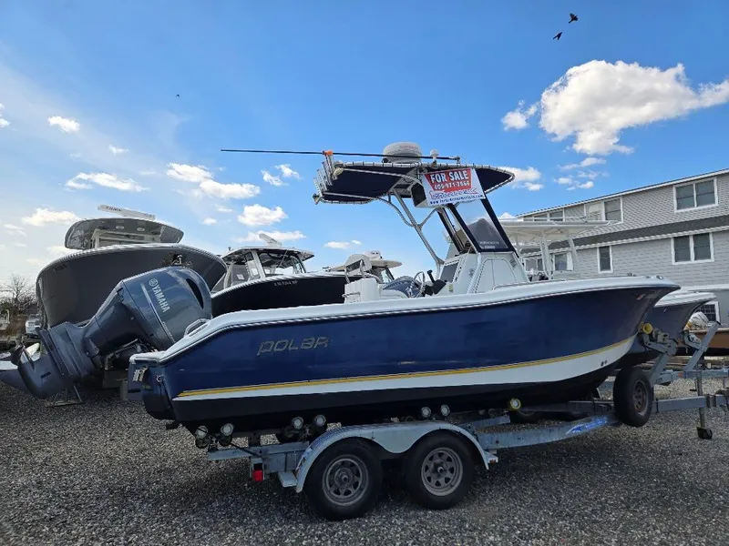 Slide: The Image of 2004 Polar 2100 CC Center Console boat for sale on trailer. - 1