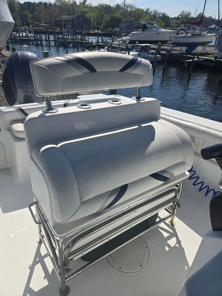 Slide: The Image of 2004 Polar 2100 CC boat seat at marina. - 7