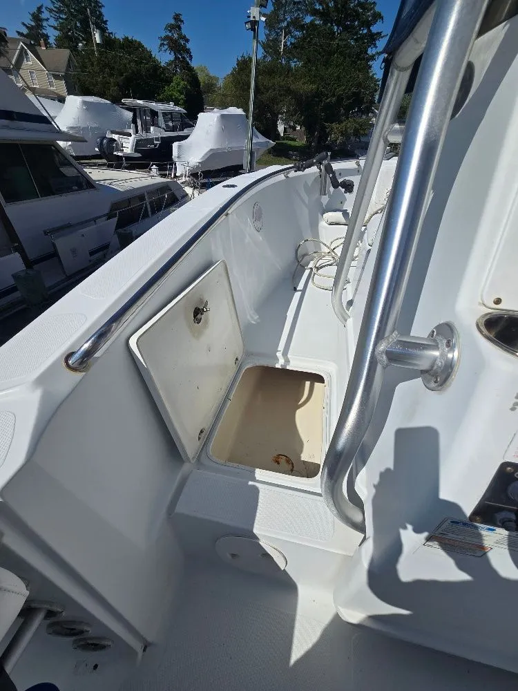 Slide: The Image of 2004 Polar 2100 CC Center Console boat with open storage compartment. - 17