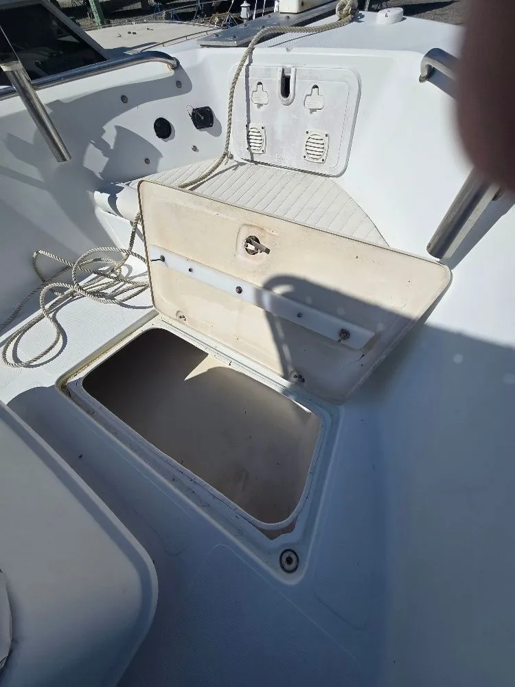 Slide: The Image of Open storage compartment on a 2004 Polar 2100 CC boat. - 19