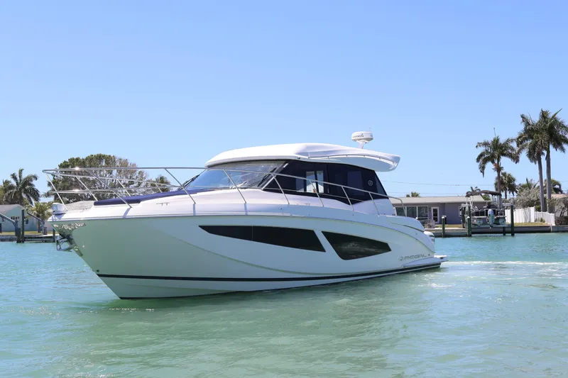 Slide: The Image of Triple Yamaha XTO Offshore engines on a 2021 Regal 42 XO boat. - 18