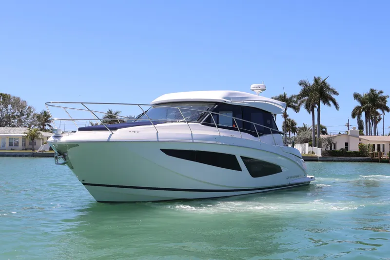 Slide: The Image of Triple Yamaha XTO Offshore engines on a 2021 Regal 42 XO boat. - 19