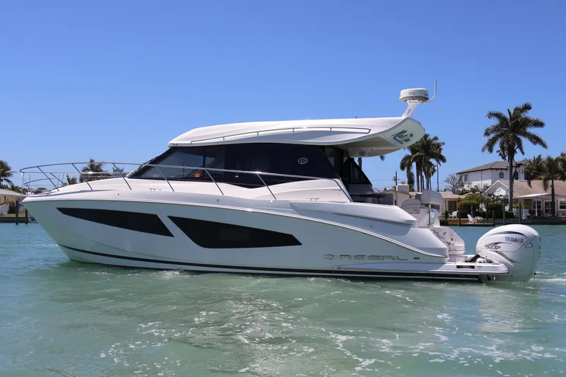 Slide: The Image of Luxurious seating area on 2021 Regal 42 XO yacht with waterfront view. - 21