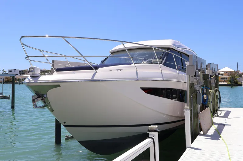 Slide: The Image of Luxurious seating area on 2021 Regal 42 XO yacht with elegant table and waterfront view. - 22