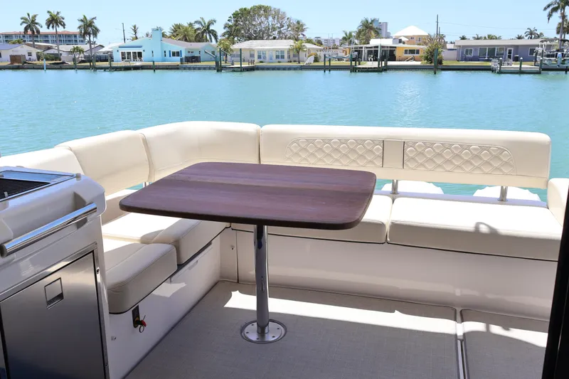 Slide: The Image of Modern kitchen appliances in a 2021 Regal 42 XO yacht, featuring stainless steel finishes. - 33