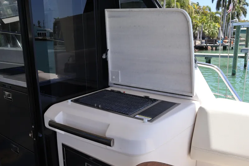 Slide: The Image of Luxurious interior of 2021 Regal 42 XO yacht with elegant seating and decorative pillows. - 37