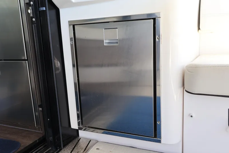 Slide: The Image of Interior view of 2021 Regal 42 XO yacht with plush seating and decorative pillows. - 39