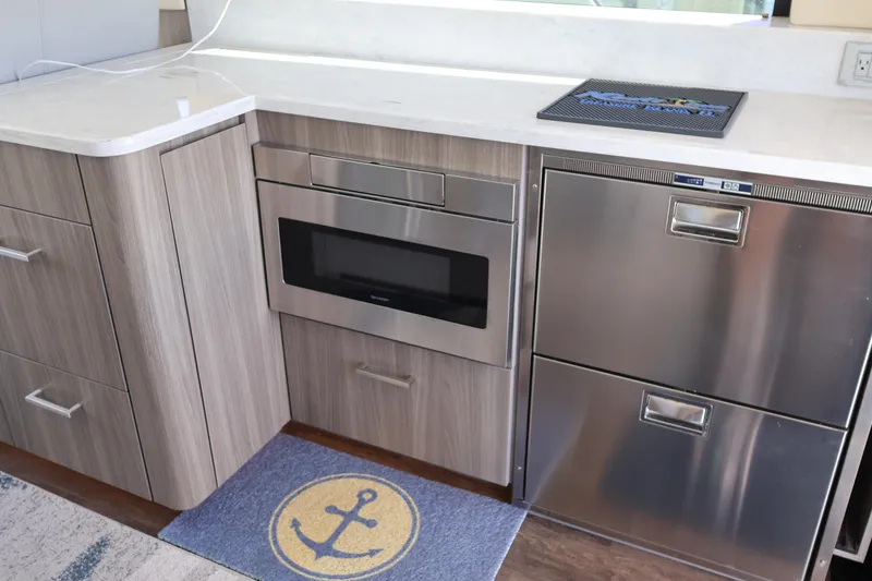 Slide: The Image of Dashboard of a 2021 Regal 42 XO boat with Garmin navigation displays. - 42