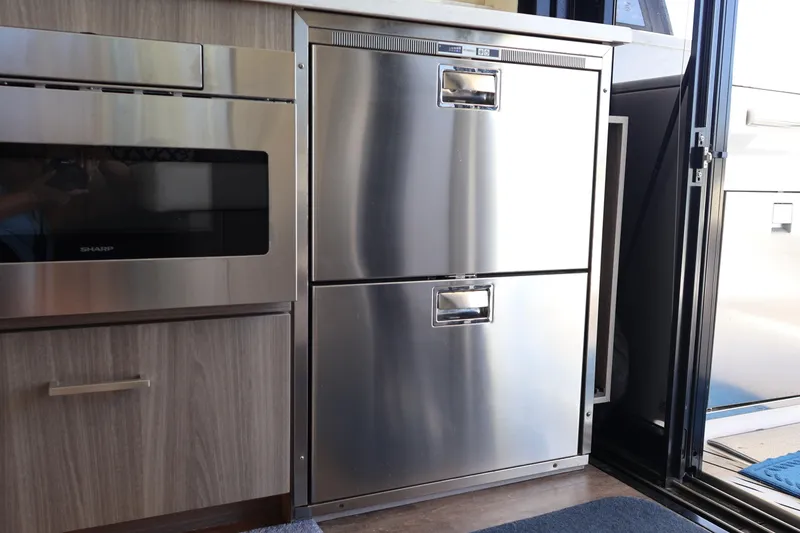 Slide: The Image of Throttle control of 2021 Regal 42 XO yacht, featuring Yamaha controls and buttons. - 44