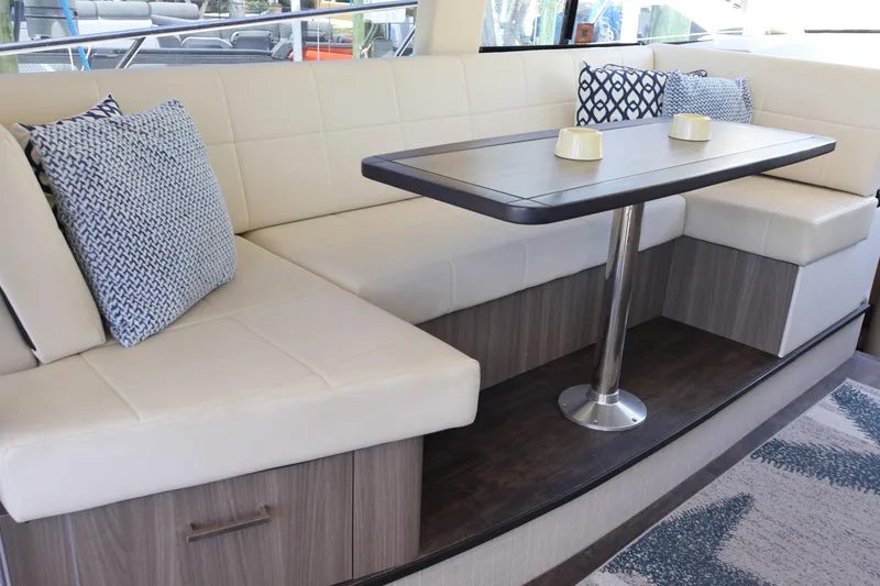 Slide: The Image of Interior stairs of 2021 Regal 42 XO yacht, featuring sleek wood design and metal railing. - 48