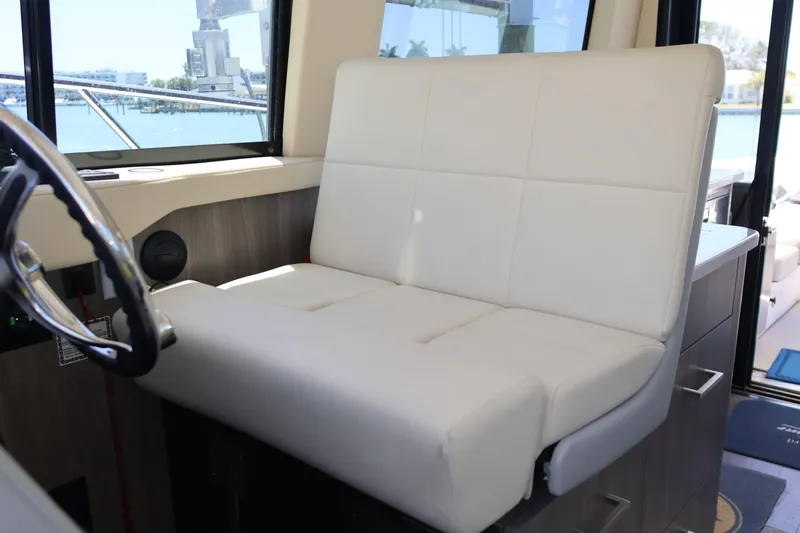 Slide: The Image of Luxurious bedroom interior of 2021 Regal 42 XO yacht with plush bedding and pillows. - 58