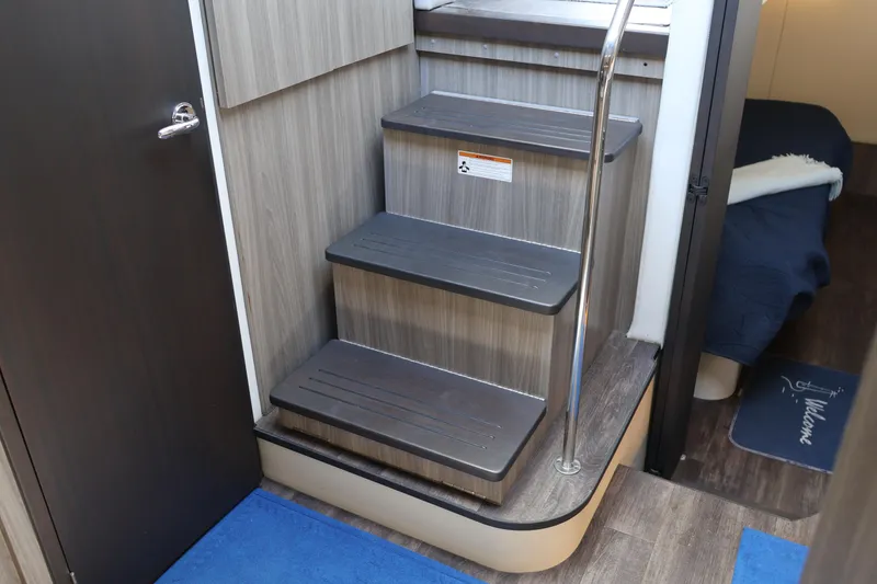 Slide: The Image of Luxurious 2021 Regal 42 XO yacht interior with cozy bedroom and modern bathroom. - 60