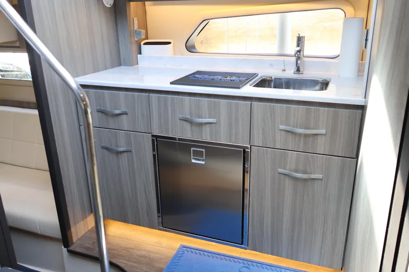 Slide: The Image of Luxurious bathroom interior of 2021 Regal 42 XO yacht with modern fixtures and wood accents. - 61