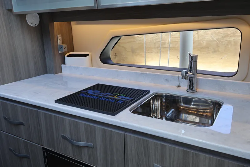 Slide: The Image of Modern bathroom interior of 2021 Regal 42 XO yacht with sleek sink and window view. - 62