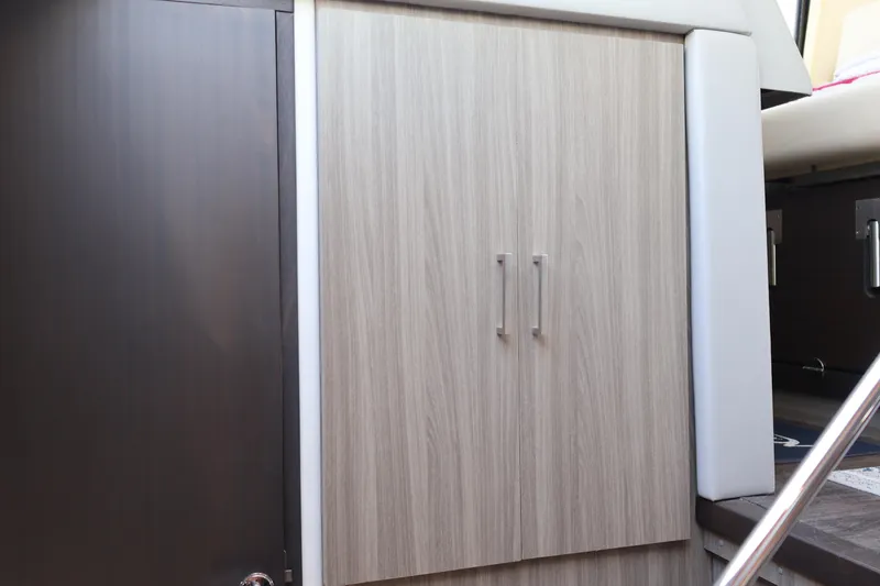 Slide: The Image of Wooden drawers in a 2021 Regal 42 XO yacht interior. - 63