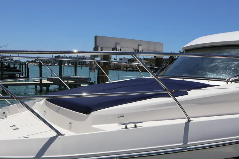 Slide: The Image of Bow of 2021 Regal 42 XO boat with storage compartments and railing. - 72