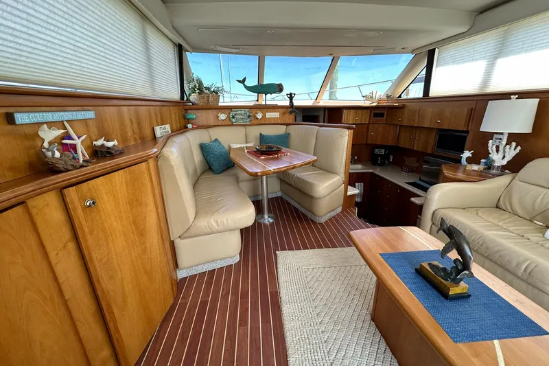 Slide: The Image of Luxurious interior of a 2001 Silverton 42 Convertible yacht with elegant wood finishes. - 6