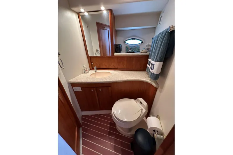 Slide: The Image of Bathroom interior of 2001 Silverton 42 Convertible yacht with modern fixtures. - 9