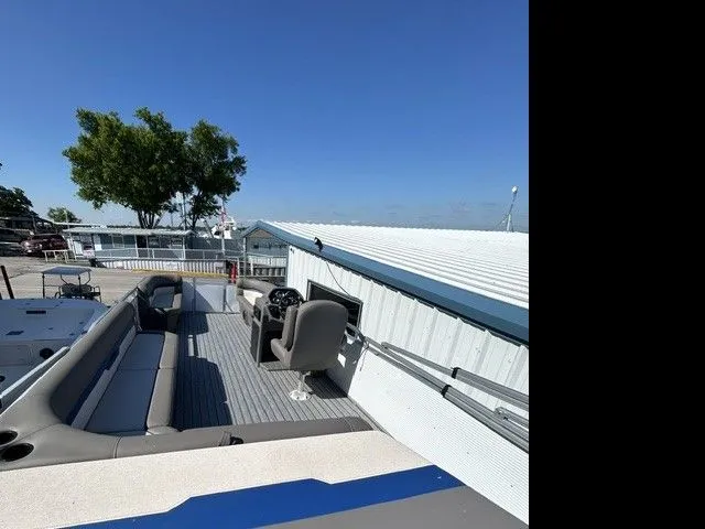 Slide: The Image of 2025 Armada Saphir 23CR Tritoon with Suzuki engine and trailer. - 11