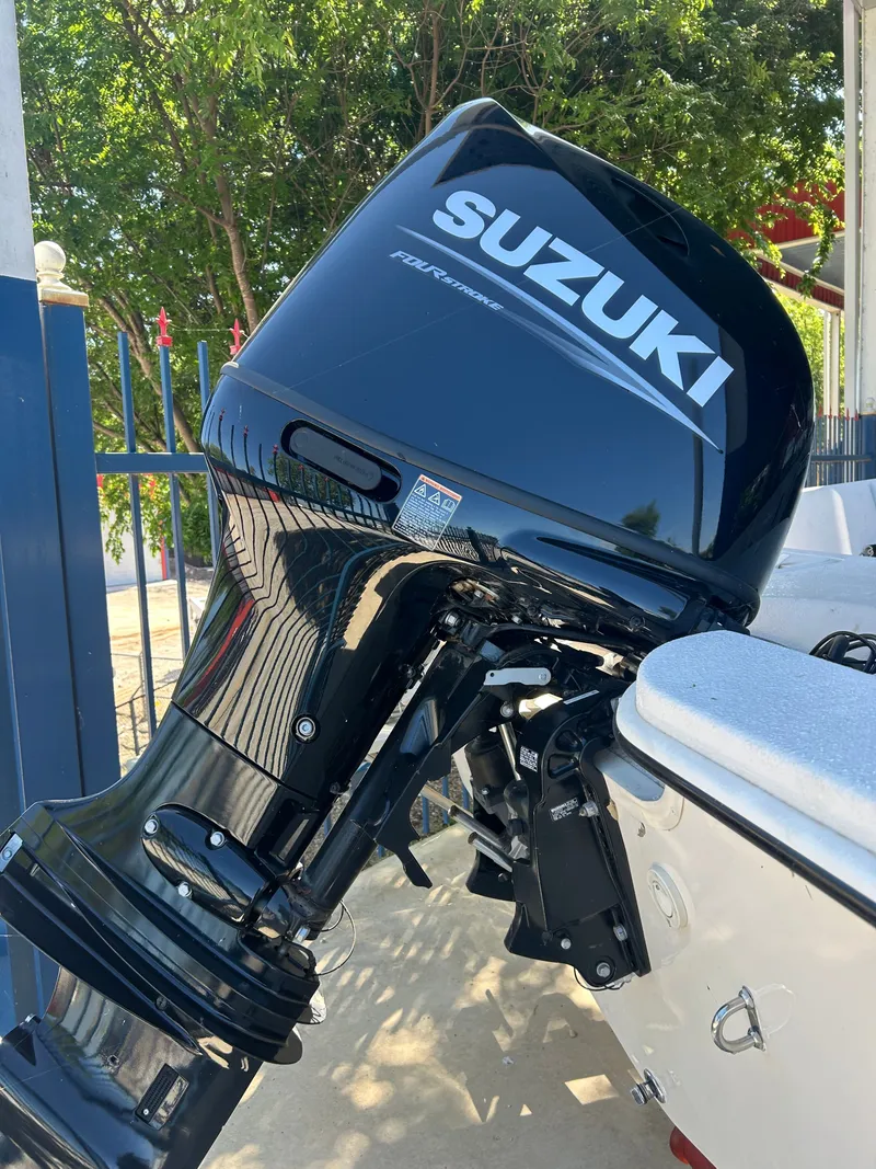 Slide: The Image of Suzuki 150HP outboard motor on 2025 Carolina Skiff EV198. - 10