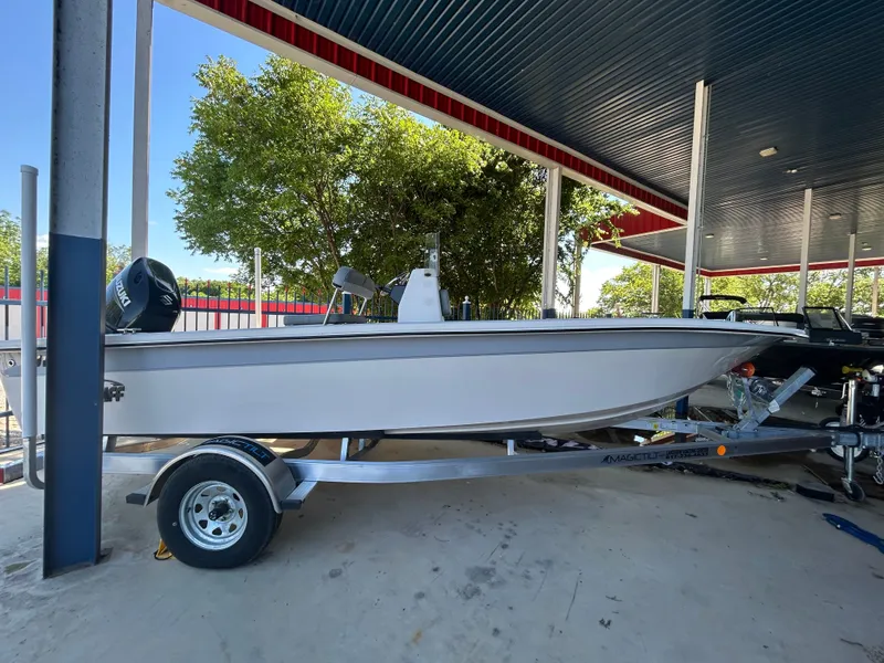 Slide: The Image of 2025 Carolina Skiff EV198 boat with 150HP Suzuki and aluminum trailer. - 11