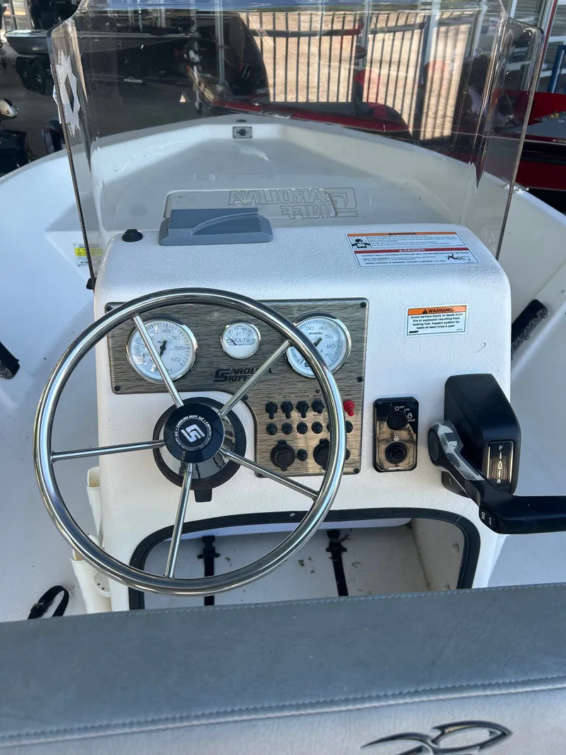 Slide: The Image of Steering console of Carolina Skiff EV198 boat, year 2025. - 9