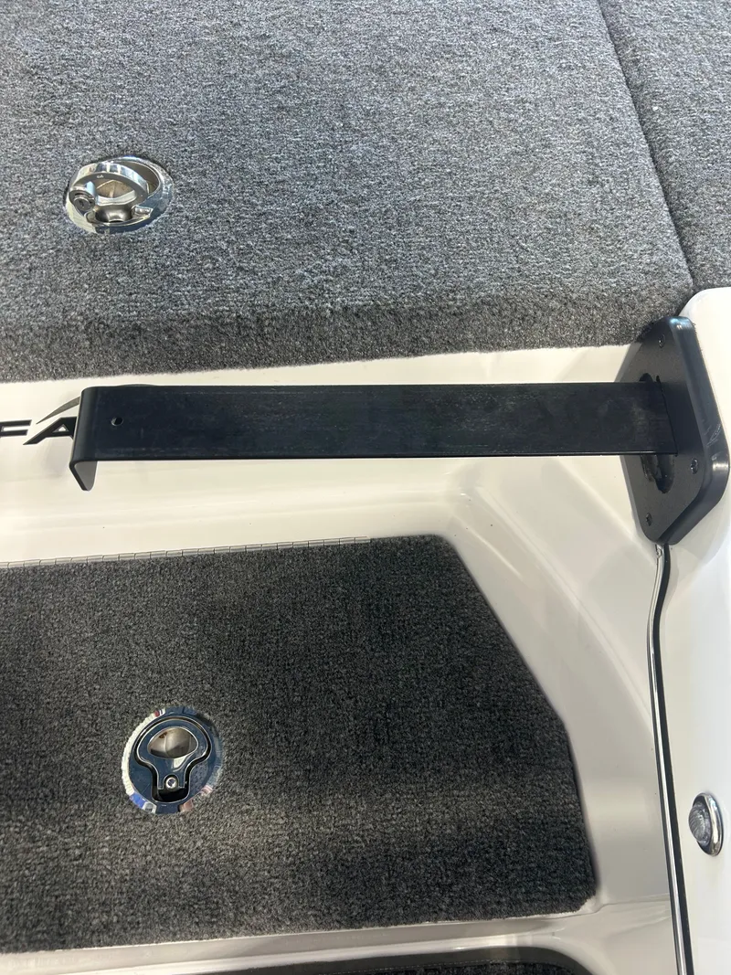 Slide: The Image of 2025 Falcon F215 boat with carpeted deck and metal fittings. - 10
