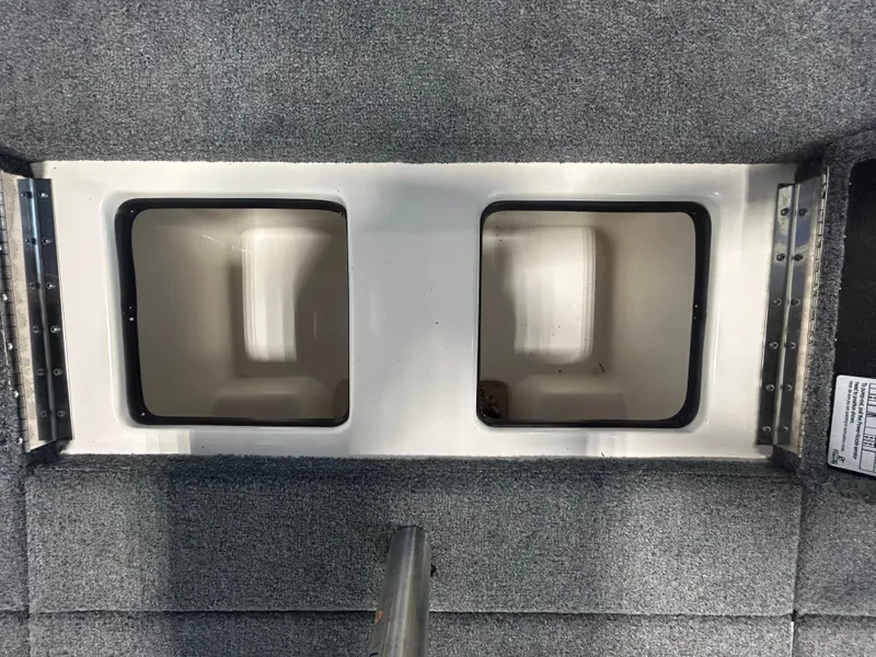 Slide: The Image of Falcon F215 boat interior with two storage compartments, 2025 model. - 13