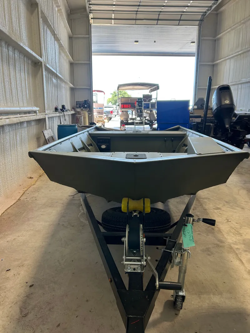 Slide: The Image of 2026 SeaArk 1448MV fishing boat with trailer in garage. - 8