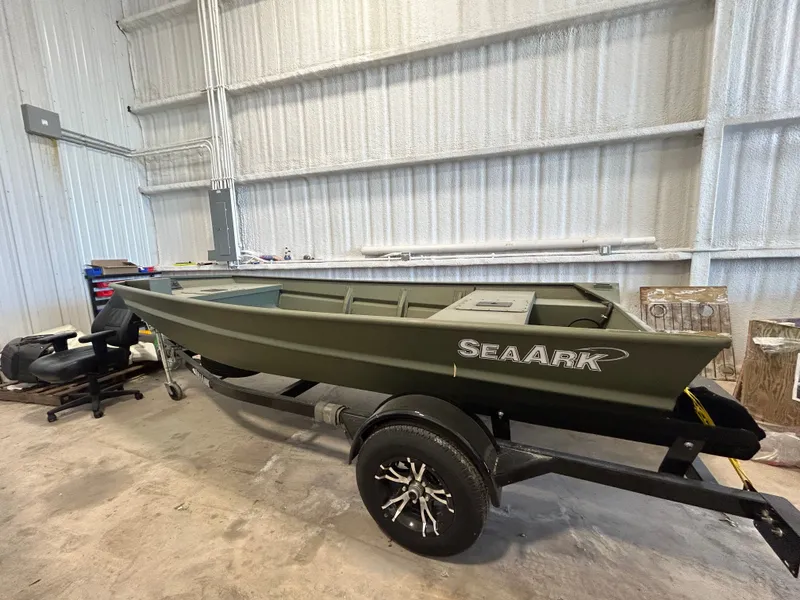 Slide: The Image of 2026 SeaArk 1448MV fishing boat with trailer in warehouse. - 9