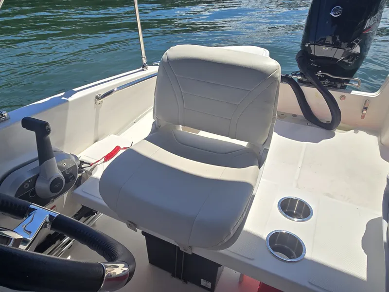 Slide: The Image of A modern helm with a comfortable seat and an engine in the background. - 9