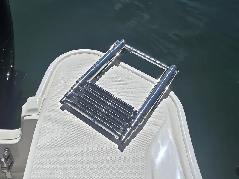 Slide: The Image of A stainless steel swim ladder on a boat deck, ready for use. - 7