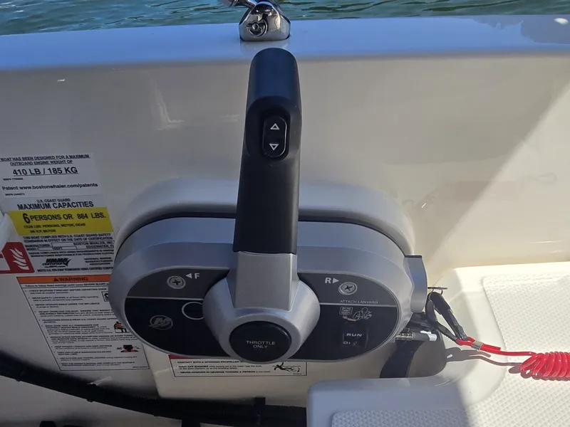 Slide: The Image of Close-up of the control console on a 2026 Boston Whaler 160 Super Sport. - 13
