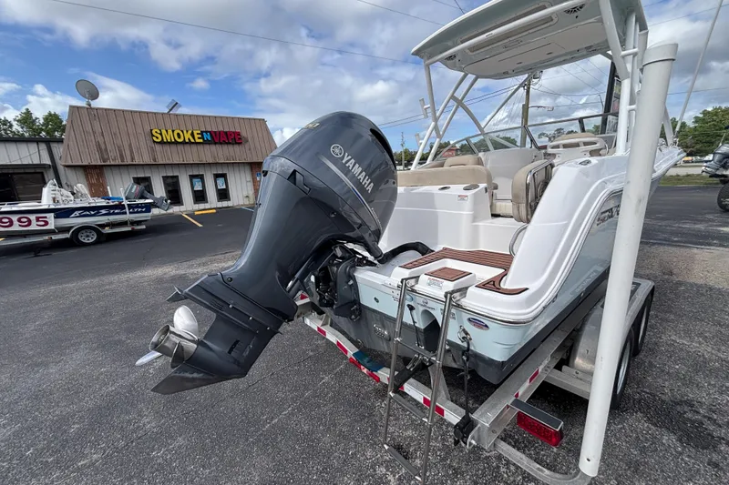 Slide: The Image of 2019 Sea Fox 226 Traveler boat with Yamaha engine on trailer, parked near a store. - 14