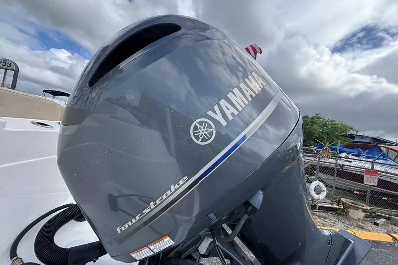 Slide: The Image of Yamaha four-stroke engine on a 2019 Sea Fox 226 Traveler boat, cloudy sky background. - 15