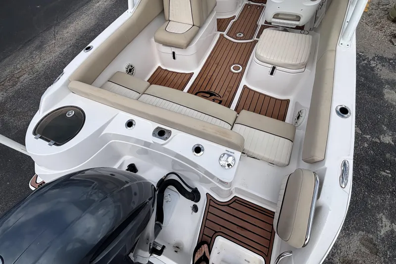Slide: The Image of 2019 Sea Fox 226 Traveler boat interior with cushioned seating and wood-style flooring. - 17
