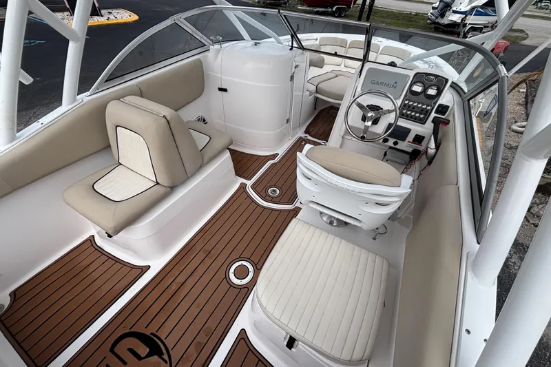 Slide: The Image of 2019 Sea Fox 226 Traveler boat interior with beige seating and wood-style flooring. - 19