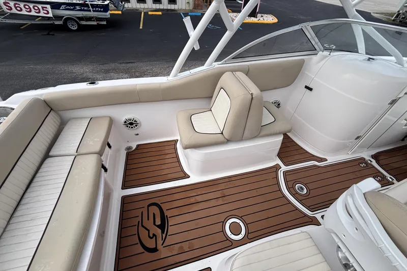 Slide: The Image of 2019 Sea Fox 226 Traveler boat interior with beige seating and wood-style flooring. - 20